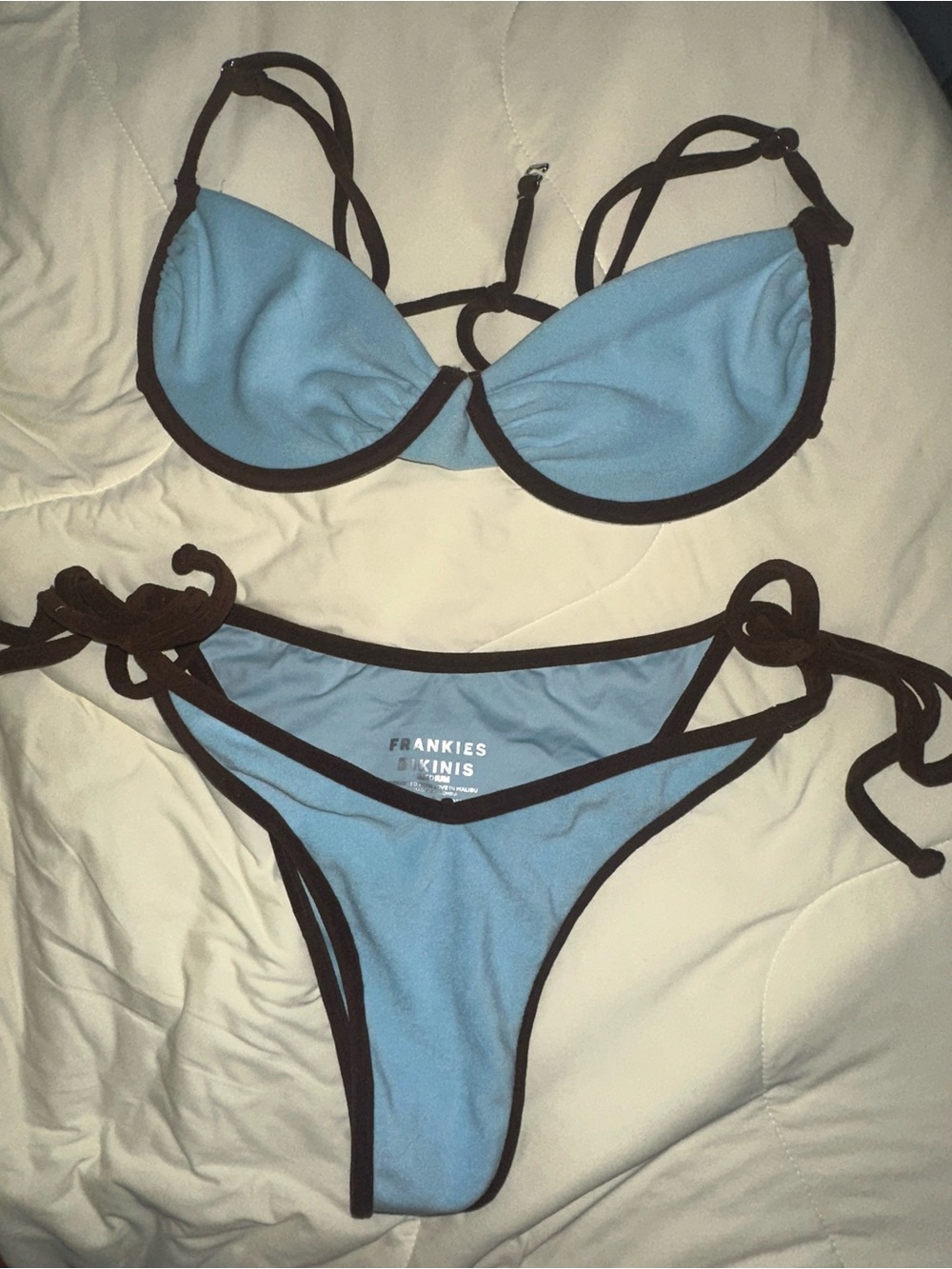 Frankie’s Bikini’s blue large top & medium brown bottoms